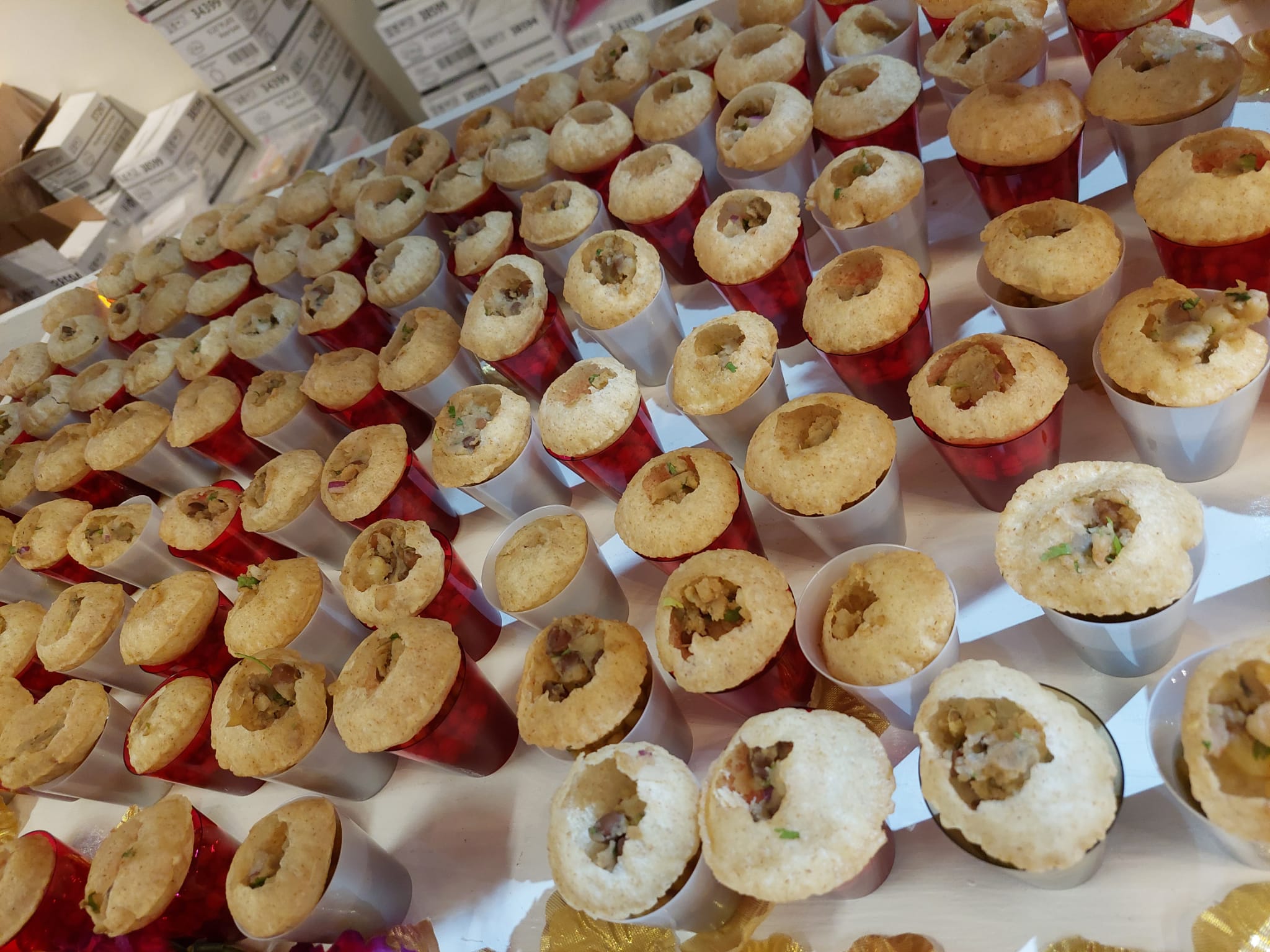 Pani puri tasting station with dozens of filled shells