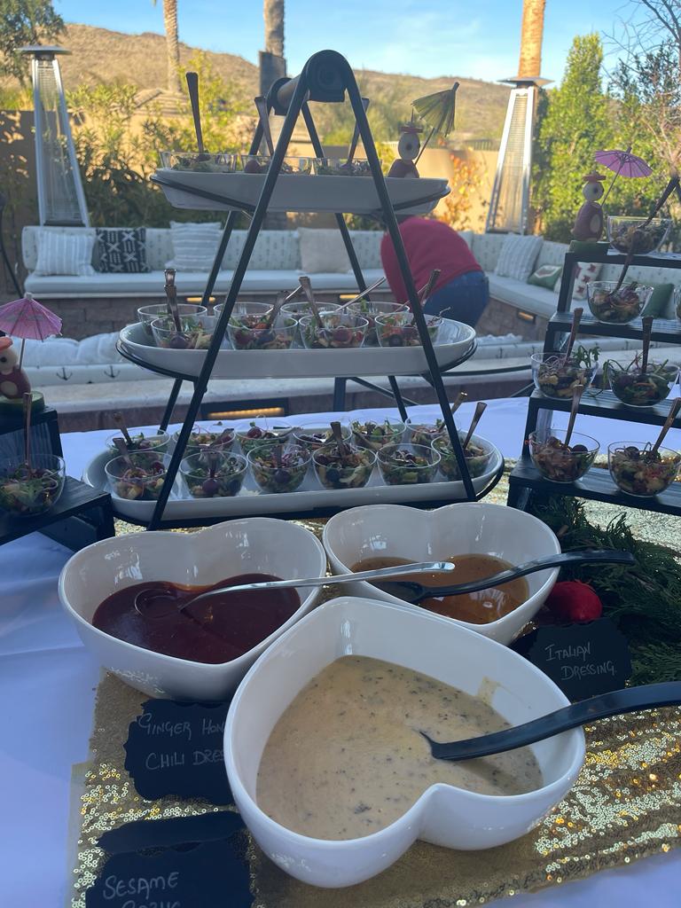 Poolside salad bar with heart-shaped dressing bowls